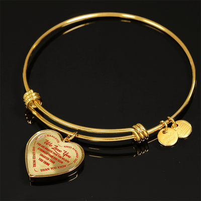 TO OUR DAUGHTER, WE LOVE YOU - SILVER OR GOLD FINISHED HEART SHAPED BANGLE BRACELET (RED ON TRANSPARENT)
