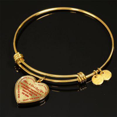 TO OUR DAUGHTER, YOU ARE BRAVER, MOM & DAD LOVE YOU - GOLD AND SILVER FINISHED HEART SHAPED BANGLE BRACELET (RED TEXT ON TRANSPARENT)