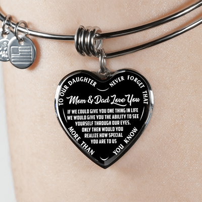 TO OUR DAUGHTER, MOM & DAD LOVE YOU, NEVER FORGET THAT - GOLD AND SILVER FINISHED HEART SHAPED BANGLE BRACELET (WHITE TEXT ON BLACK)