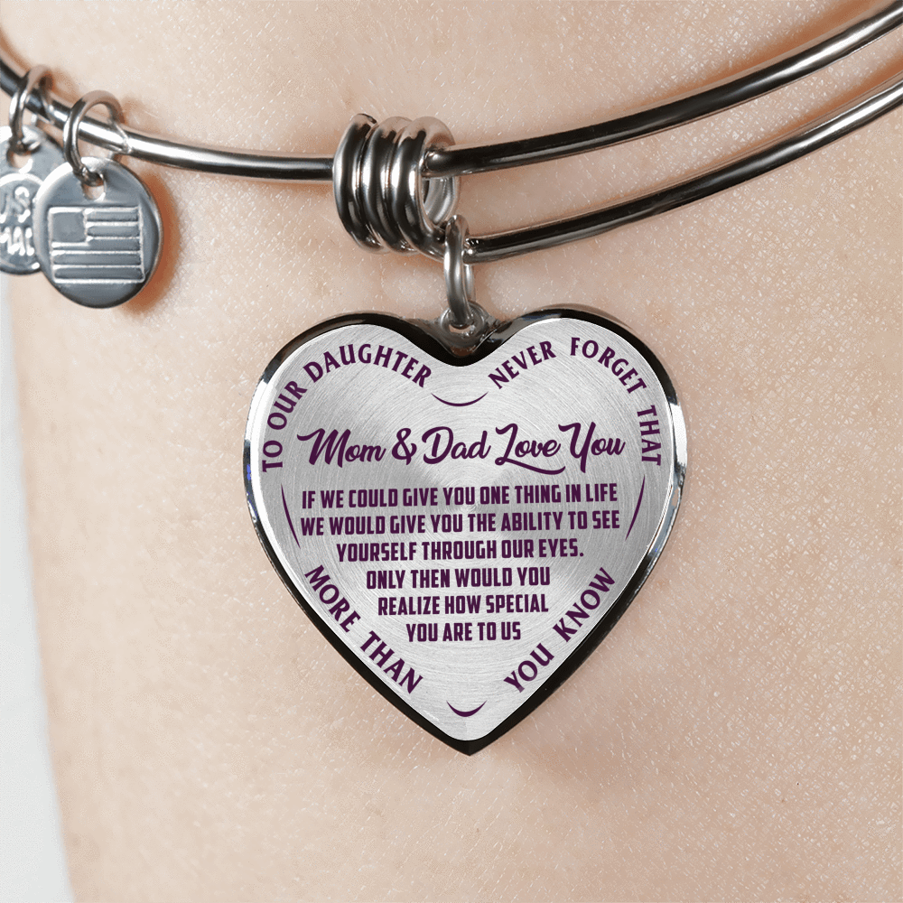 TO OUR DAUGHTER, MOM & DAD LOVE YOU, NEVER FORGET THAT - GOLD AND SILVER FINISHED HEART SHAPED BANGLE BRACELET (PURPLE TEXT ON TRANSPARENT)