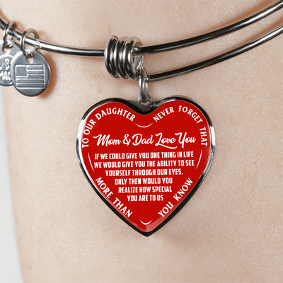 TO OUR DAUGHTER, MOM & DAD LOVE YOU, NEVER FORGET THAT - GOLD AND SILVER FINISHED HEART SHAPED BANGLE BRACELET (WHITE TEXT ON RED)