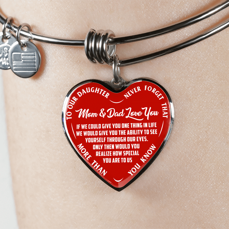 TO OUR DAUGHTER, MOM & DAD LOVE YOU, NEVER FORGET THAT - GOLD AND SILVER FINISHED HEART SHAPED BANGLE BRACELET (WHITE TEXT ON RED)