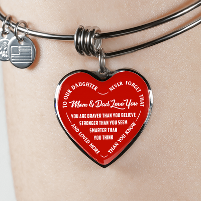 TO OUR DAUGHTER, YOU ARE BRAVER, MOM & DAD LOVE YOU - GOLD AND SILVER FINISHED HEART SHAPED BANGLE BRACELET (WHITE TEXT ON RED)