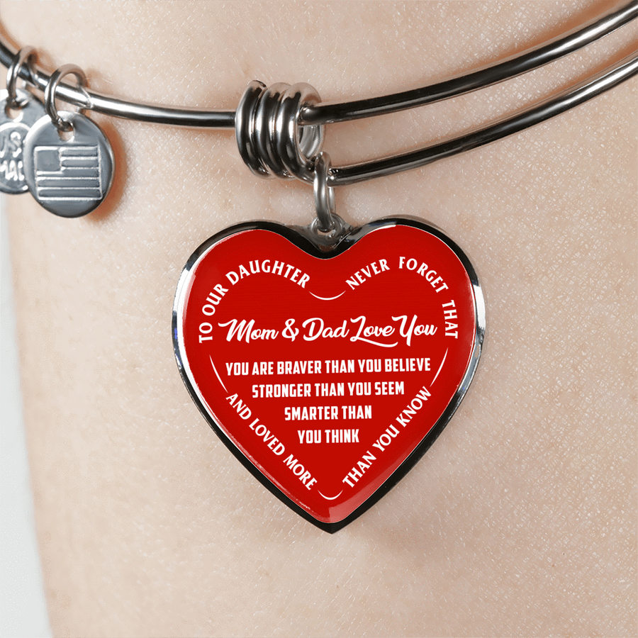 TO OUR DAUGHTER, YOU ARE BRAVER, MOM & DAD LOVE YOU - GOLD AND SILVER FINISHED HEART SHAPED BANGLE BRACELET (WHITE TEXT ON RED)