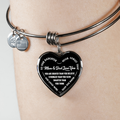 TO OUR DAUGHTER, YOU ARE BRAVER, MOM & DAD LOVE YOU - GOLD AND SILVER FINISHED HEART SHAPED NECKLACE AND BANGLE BRACELET (WHITE TEXT ON BLACK) EO
