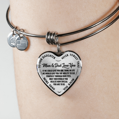 TO OUR DAUGHTER, MOM & DAD LOVE YOU, NEVER FORGET THAT - GOLD AND SILVER FINISHED HEART SHAPED BANGLE BRACELET (BLACK TEXT ON TRANSPARENT)
