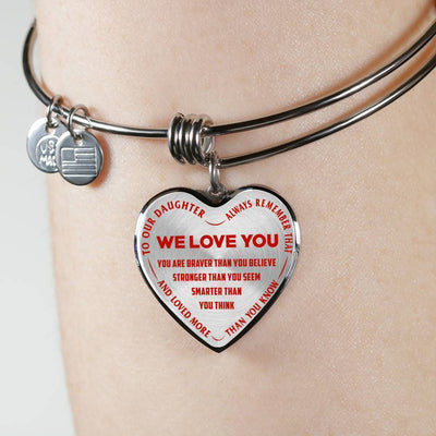 TO OUR DAUGHTER, ALWAYS REMEMBER THAT, WE LOVE YOU - (RED ON TRANSPARENT) SILVER OR GOLD FINISHED HEART SHAPED BANGLE BRACELET NEW