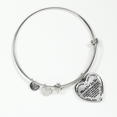 TO OUR DAUGHTER, MOM & DAD LOVE YOU, NEVER FORGET THAT - GOLD AND SILVER FINISHED HEART SHAPED BANGLE BRACELET (BLACK TEXT ON TRANSPARENT)