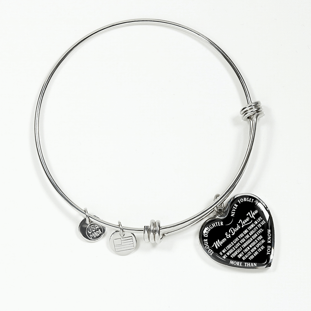 TO OUR DAUGHTER, MOM & DAD LOVE YOU, NEVER FORGET THAT - GOLD AND SILVER FINISHED HEART SHAPED BANGLE BRACELET (WHITE TEXT ON BLACK)