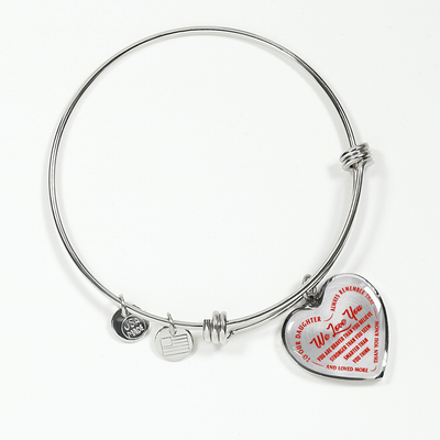 TO OUR DAUGHTER, WE LOVE YOU - SILVER OR GOLD FINISHED HEART SHAPED BANGLE BRACELET (RED ON TRANSPARENT)