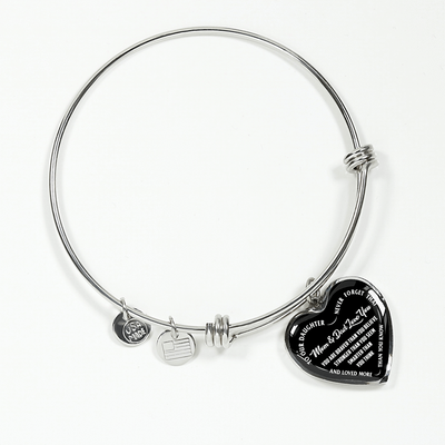 TO OUR DAUGHTER, YOU ARE BRAVER, MOM & DAD LOVE YOU - GOLD AND SILVER FINISHED HEART SHAPED BANGLE BRACELET (WHITE TEXT ON BLACK)