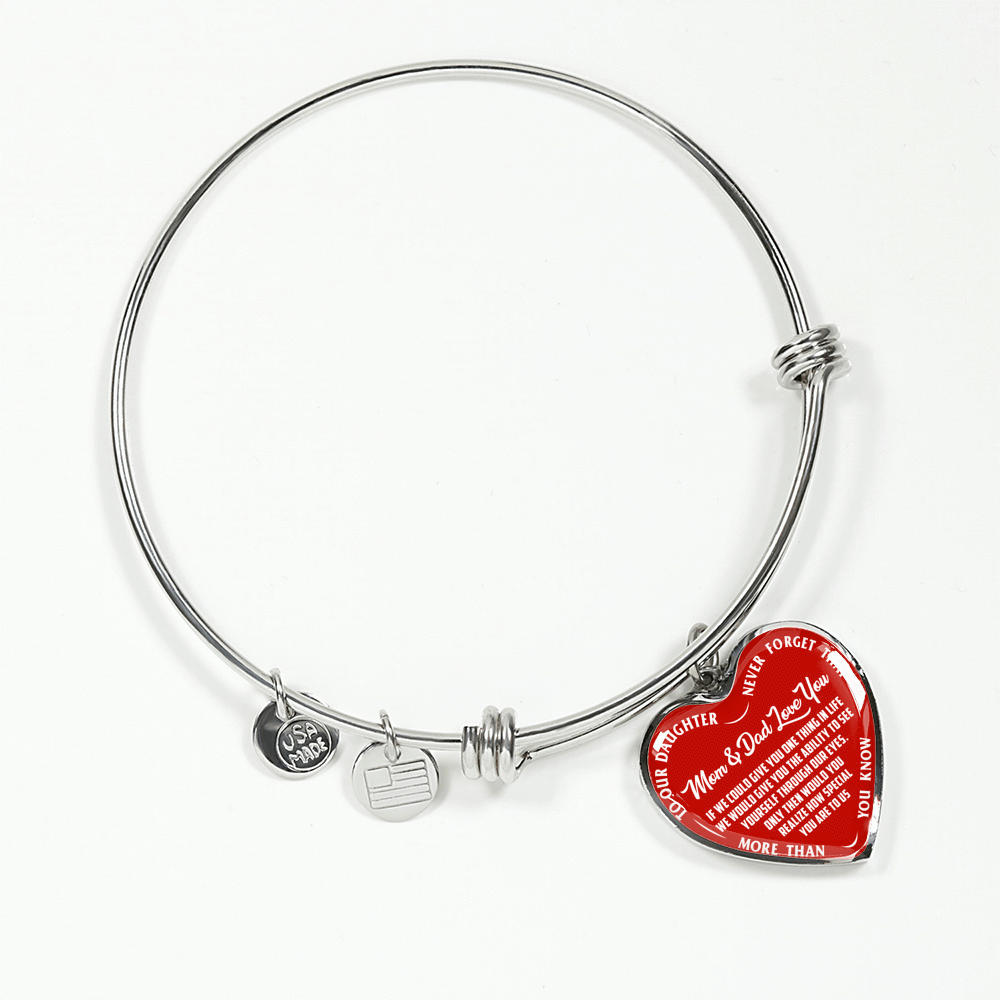TO OUR DAUGHTER, MOM & DAD LOVE YOU, NEVER FORGET THAT - GOLD AND SILVER FINISHED HEART SHAPED BANGLE BRACELET (WHITE TEXT ON RED)