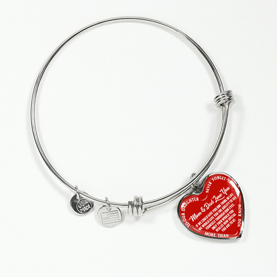 TO OUR DAUGHTER, MOM & DAD LOVE YOU, NEVER FORGET THAT - GOLD AND SILVER FINISHED HEART SHAPED BANGLE BRACELET (WHITE TEXT ON RED)