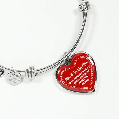 TO OUR DAUGHTER, YOU ARE BRAVER, MOM & DAD LOVE YOU - GOLD AND SILVER FINISHED HEART SHAPED BANGLE BRACELET (WHITE TEXT ON RED)