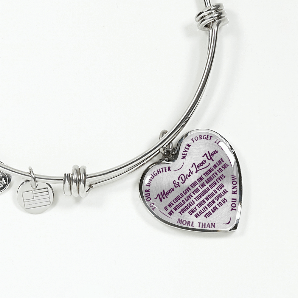TO OUR DAUGHTER, MOM & DAD LOVE YOU, NEVER FORGET THAT - GOLD AND SILVER FINISHED HEART SHAPED BANGLE BRACELET (PURPLE TEXT ON TRANSPARENT)