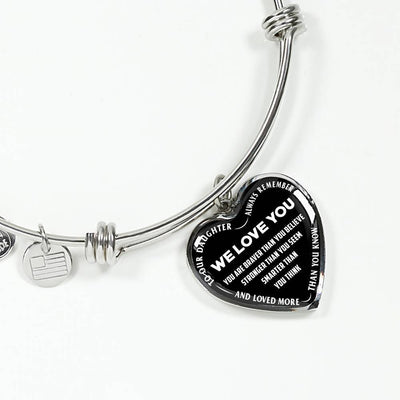TO OUR DAUGHTER, ALWAYS REMEMBER THAT, WE LOVE YOU - (WHITE ON BLACK) SILVER OR GOLD FINISHED HEART SHAPED BANGLE BRACELET NEW