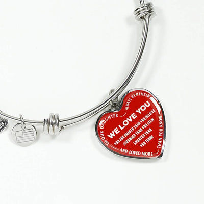 TO OUR DAUGHTER, ALWAYS REMEMBER THAT, WE LOVE YOU - (WHITE ON RED) SILVER OR GOLD FINISHED HEART SHAPED BANGLE BRACELET NEW