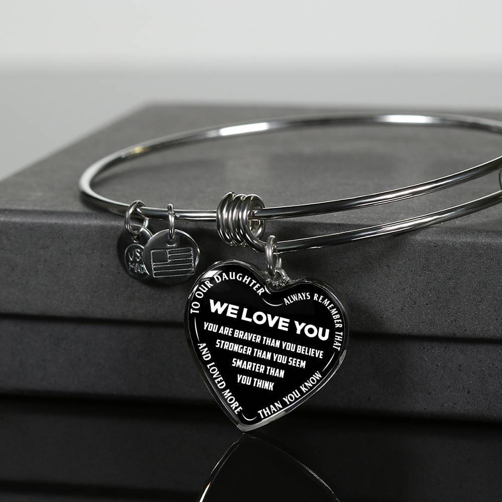 TO OUR DAUGHTER, ALWAYS REMEMBER THAT, WE LOVE YOU - (WHITE ON BLACK) SILVER OR GOLD FINISHED HEART SHAPED BANGLE BRACELET NEW