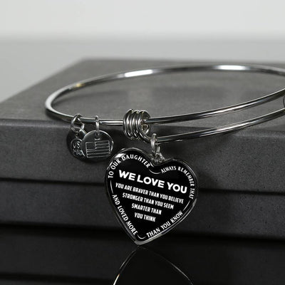 TO OUR DAUGHTER, ALWAYS REMEMBER THAT, WE LOVE YOU - (WHITE ON BLACK) SILVER OR GOLD FINISHED HEART SHAPED BANGLE BRACELET NEW