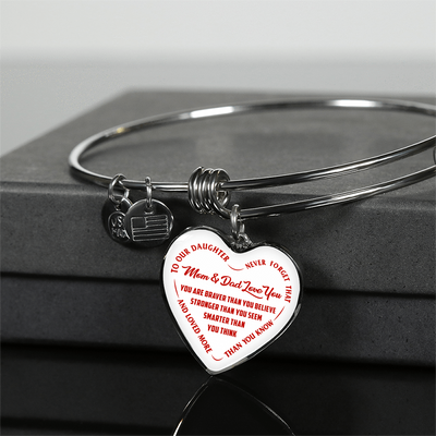 TO OUR DAUGHTER, YOU ARE BRAVER, MOM & DAD LOVE YOU - GOLD AND SILVER FINISHED HEART SHAPED NECKLACE AND BANGLE BRACELET (RED TEXT ON WHITE) EO