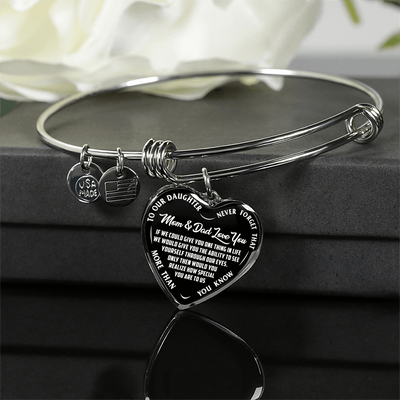 TO OUR DAUGHTER, MOM & DAD LOVE YOU, NEVER FORGET THAT - GOLD AND SILVER FINISHED HEART SHAPED BANGLE BRACELET (WHITE TEXT ON BLACK)