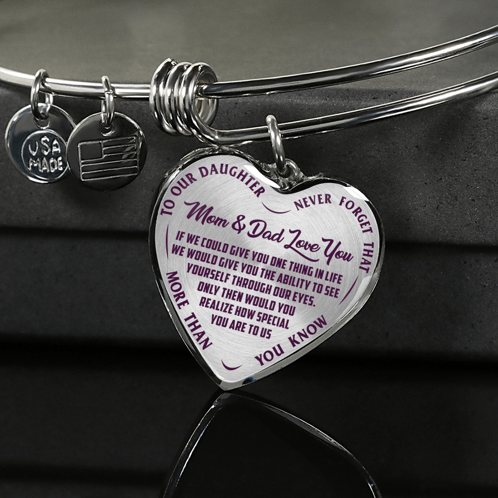 TO OUR DAUGHTER, MOM & DAD LOVE YOU, NEVER FORGET THAT - GOLD AND SILVER FINISHED HEART SHAPED BANGLE BRACELET (PURPLE TEXT ON TRANSPARENT)