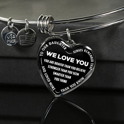TO OUR DAUGHTER, ALWAYS REMEMBER THAT, WE LOVE YOU - (WHITE ON BLACK) SILVER OR GOLD FINISHED HEART SHAPED BANGLE BRACELET NEW