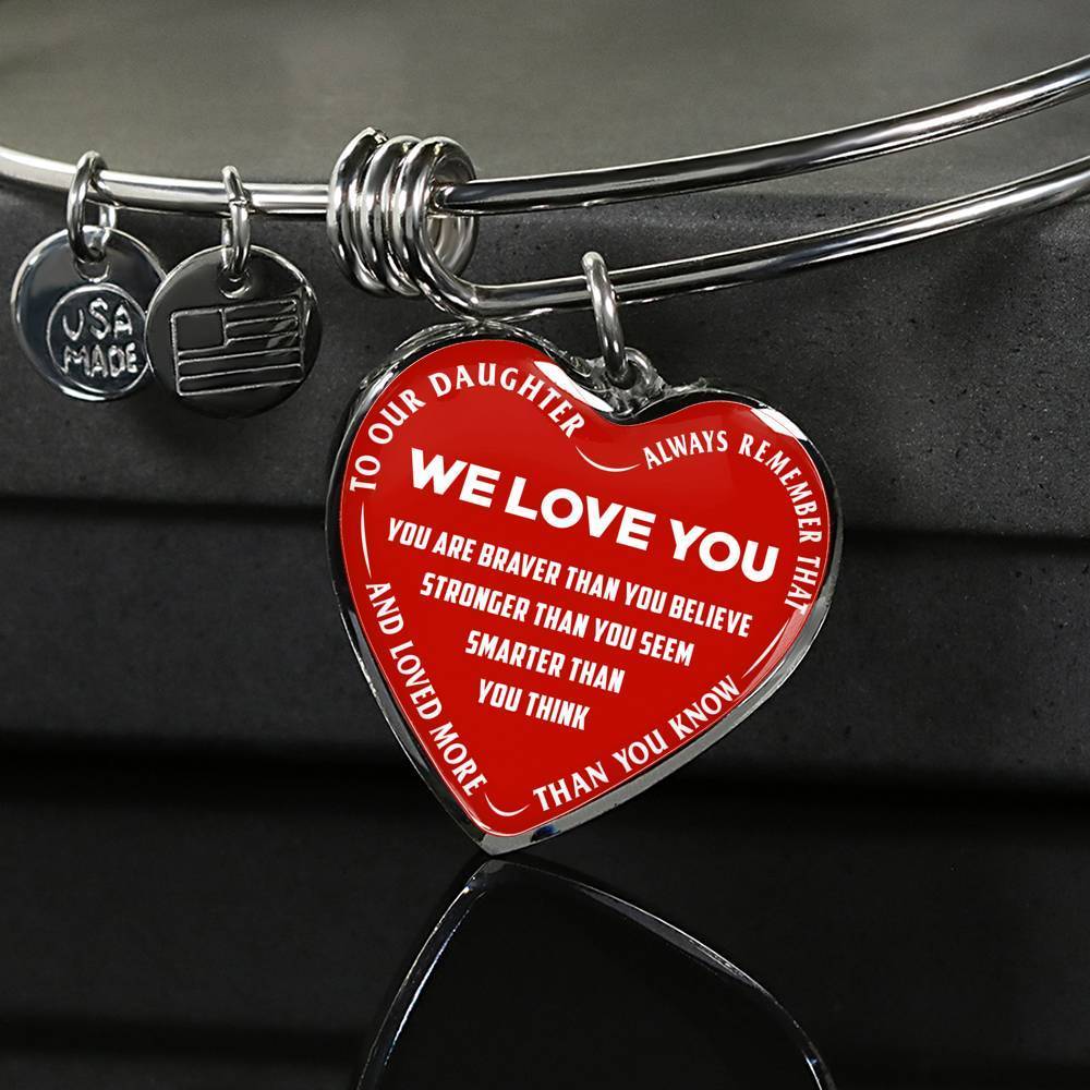 TO OUR DAUGHTER, ALWAYS REMEMBER THAT, WE LOVE YOU - (WHITE ON RED) SILVER OR GOLD FINISHED HEART SHAPED BANGLE BRACELET NEW