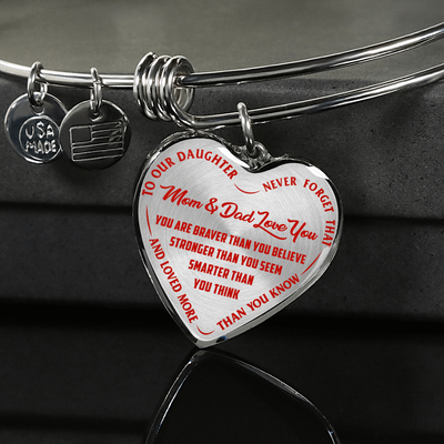 TO OUR DAUGHTER, YOU ARE BRAVER, MOM & DAD LOVE YOU - GOLD AND SILVER FINISHED HEART SHAPED NECKLACE AND BANGLE BRACELET (RED TEXT ON TRANSPARENT) EO