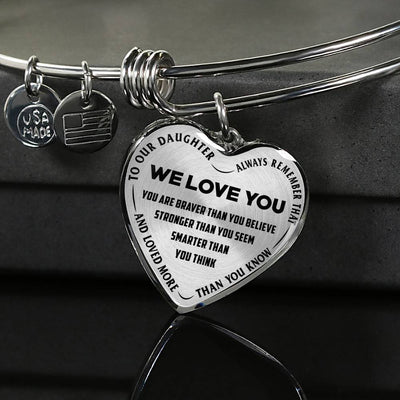 TO OUR DAUGHTER, ALWAYS REMEMBER THAT, WE LOVE YOU - (BLACK ON TRANSPARENT) SILVER OR GOLD FINISHED HEART SHAPED BANGLE BRACELET NEW